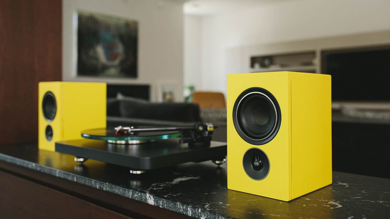 PSB Speakers Alpha IQ in Tangerine Yellow with Turntable Lifestyle