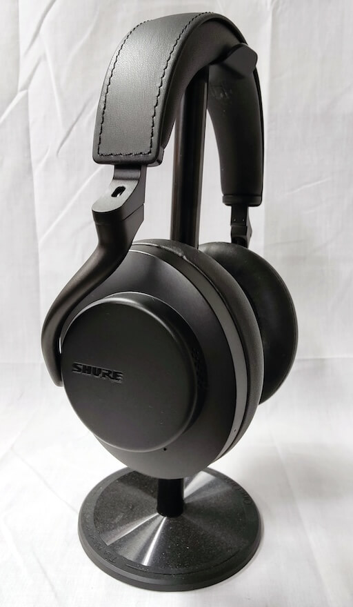 Shure AONIC 50 GEN 2 Wireless Noise Cancelling Headphones on stand angle